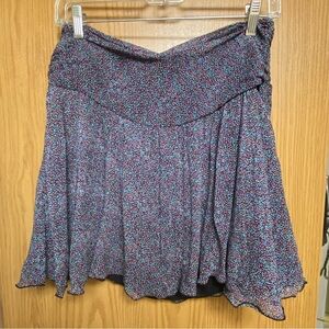 Express mini skirt black w/blue/purple/white floral pattern